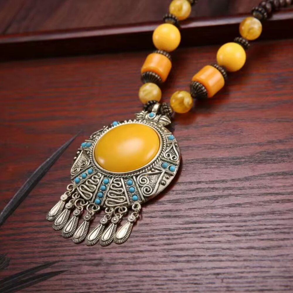 Vintage retro necklace with blue stone leaf tassels. Ethnic Tibetan jewelry.